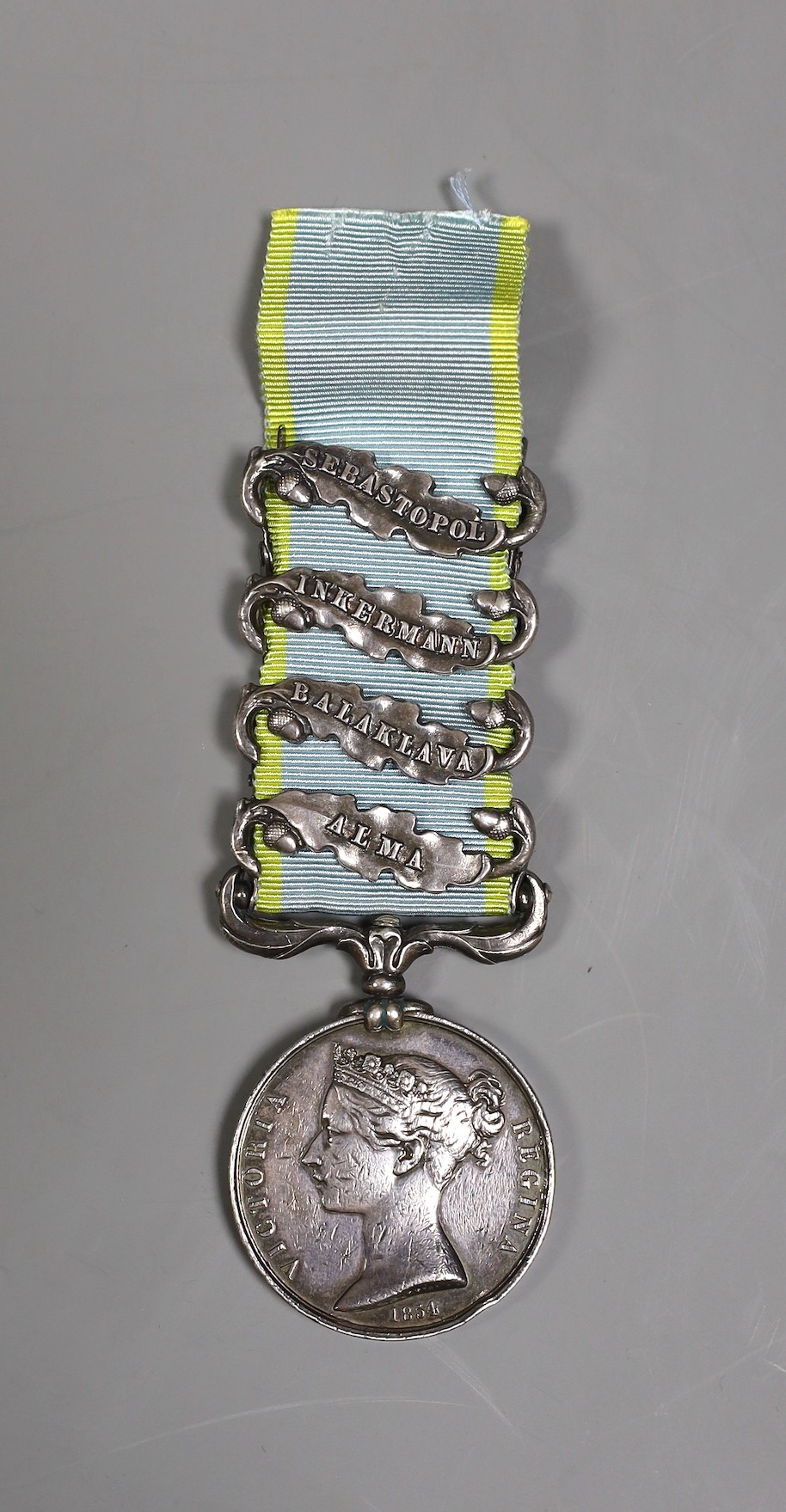 A Crimea war medal with 4 clasps - ‘Sebastopol’, ‘Inkermann’, ‘Balaklava’ and ‘Alma’ stamped 3722 GDS readable to rim